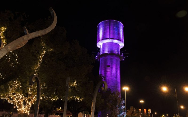 Watertower in Wodonga at night lit with purple light